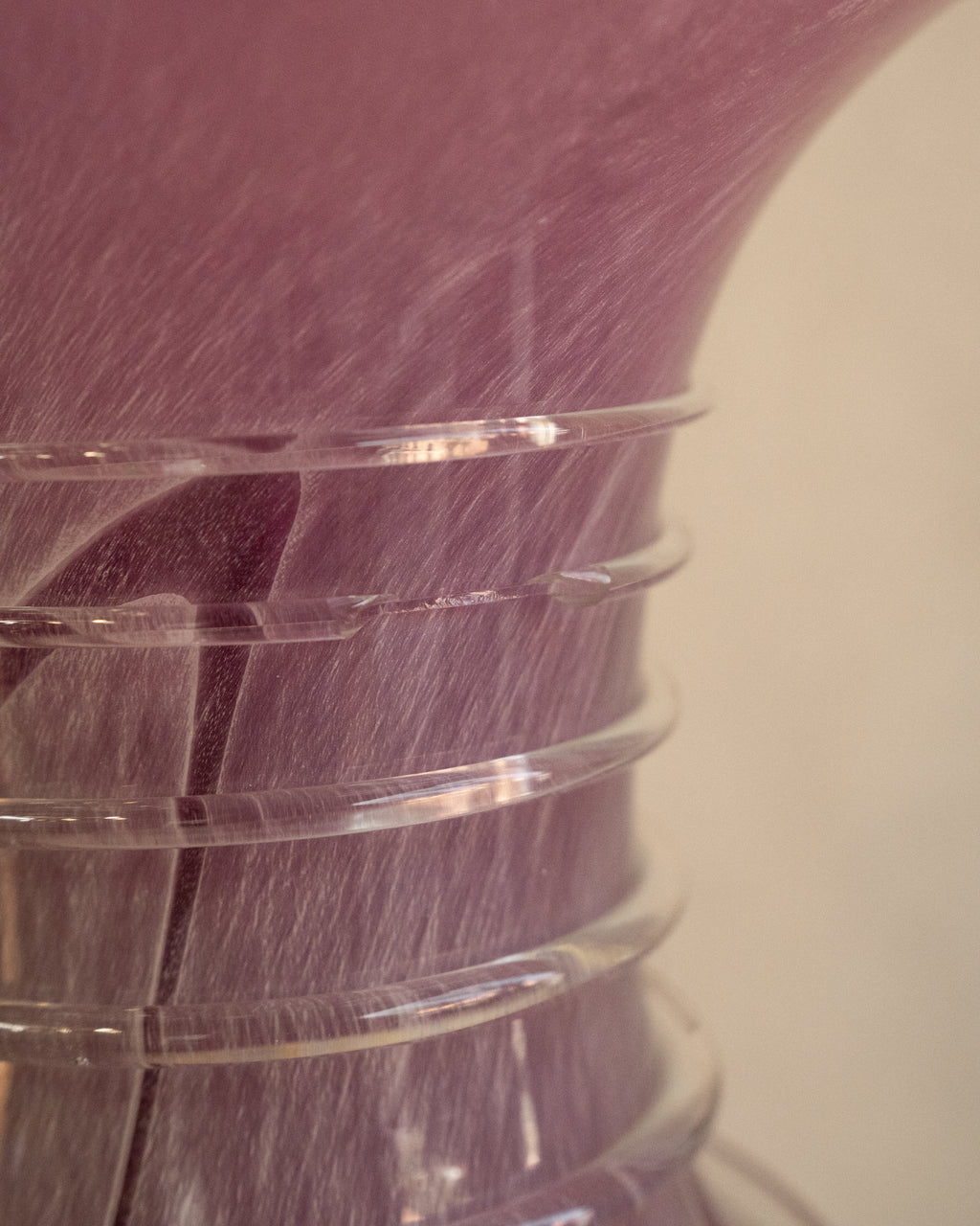 Pink art glass vase with external trailing