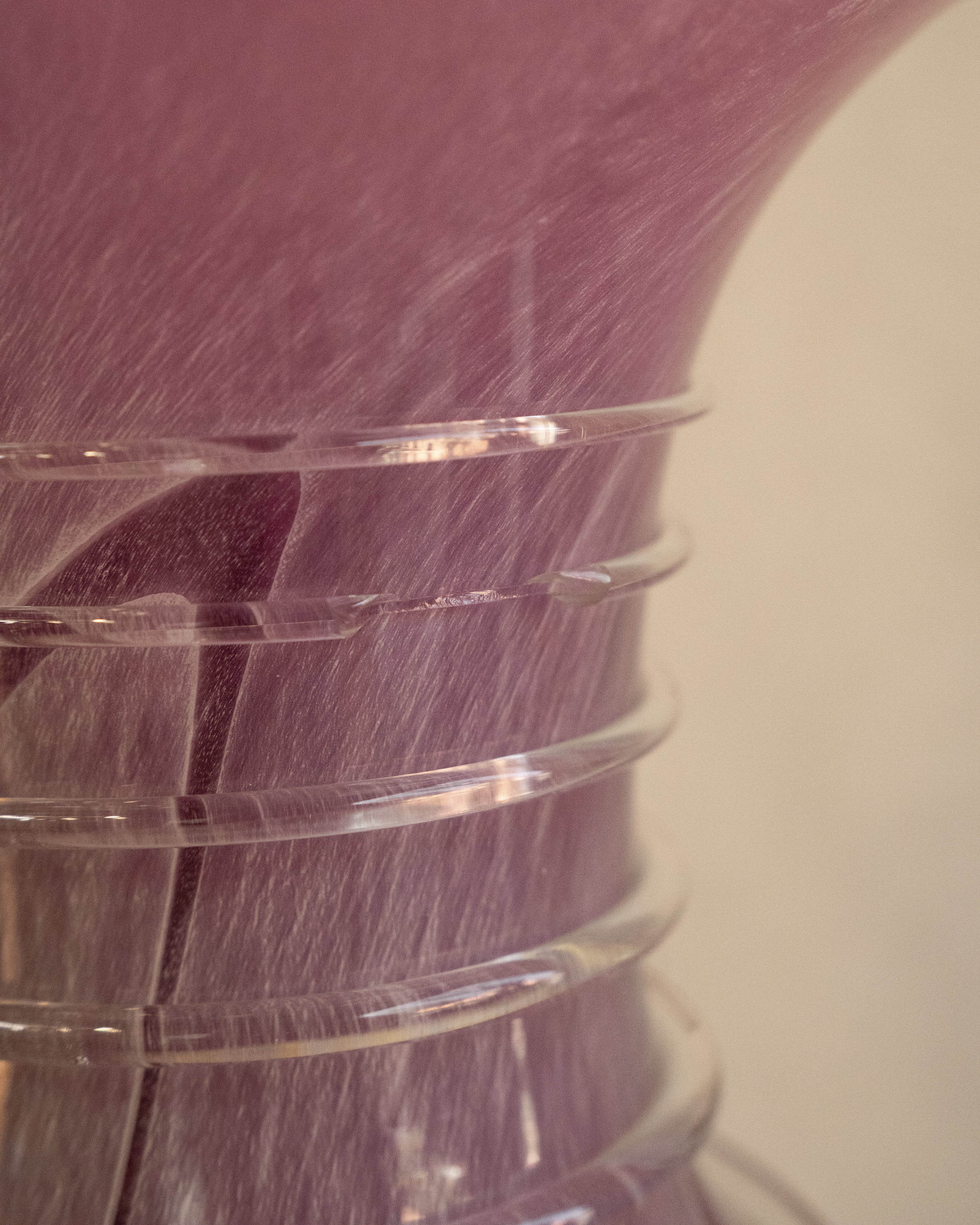 Pink art glass vase with external trailing