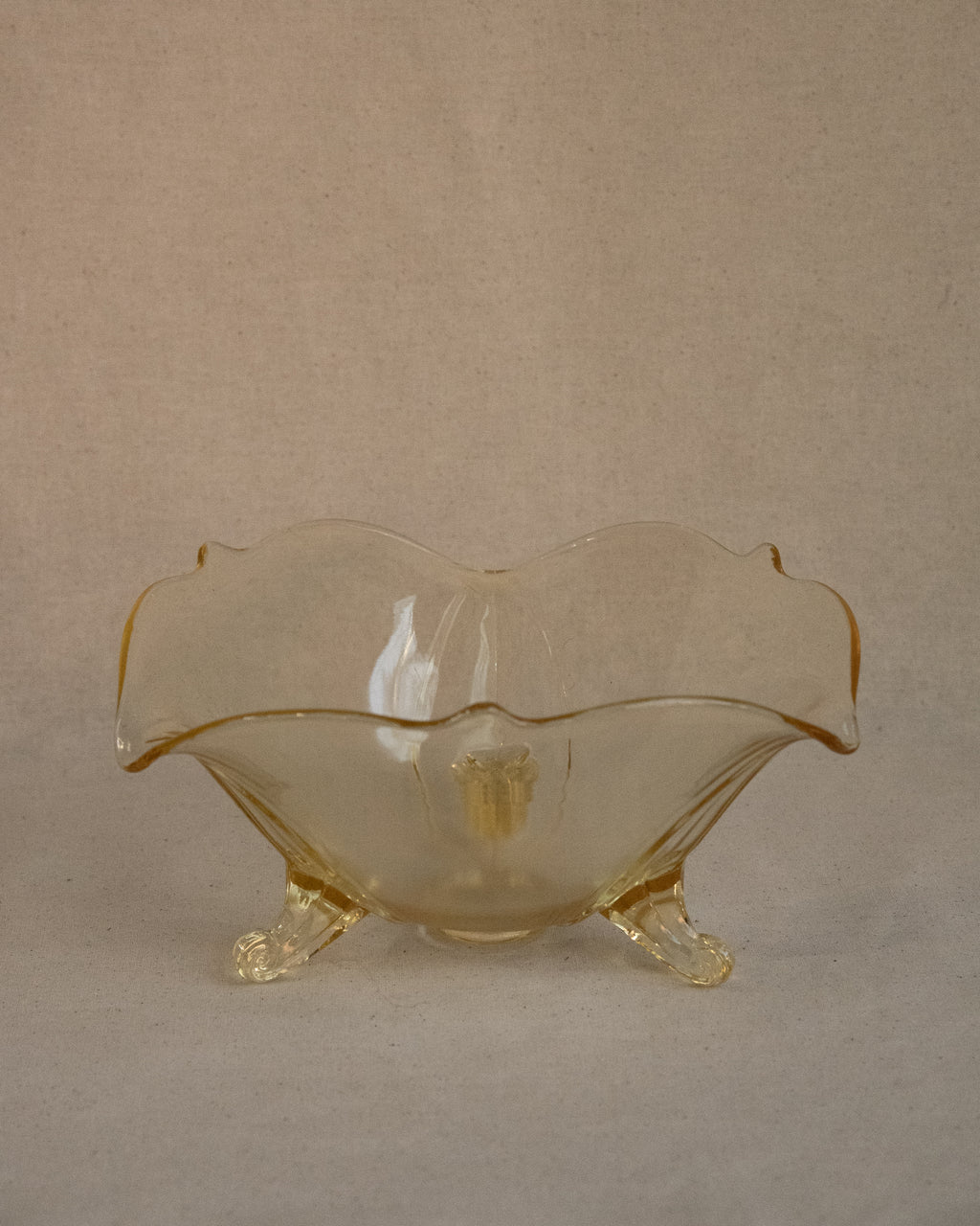 Yellow art glass bowl with spiral feet