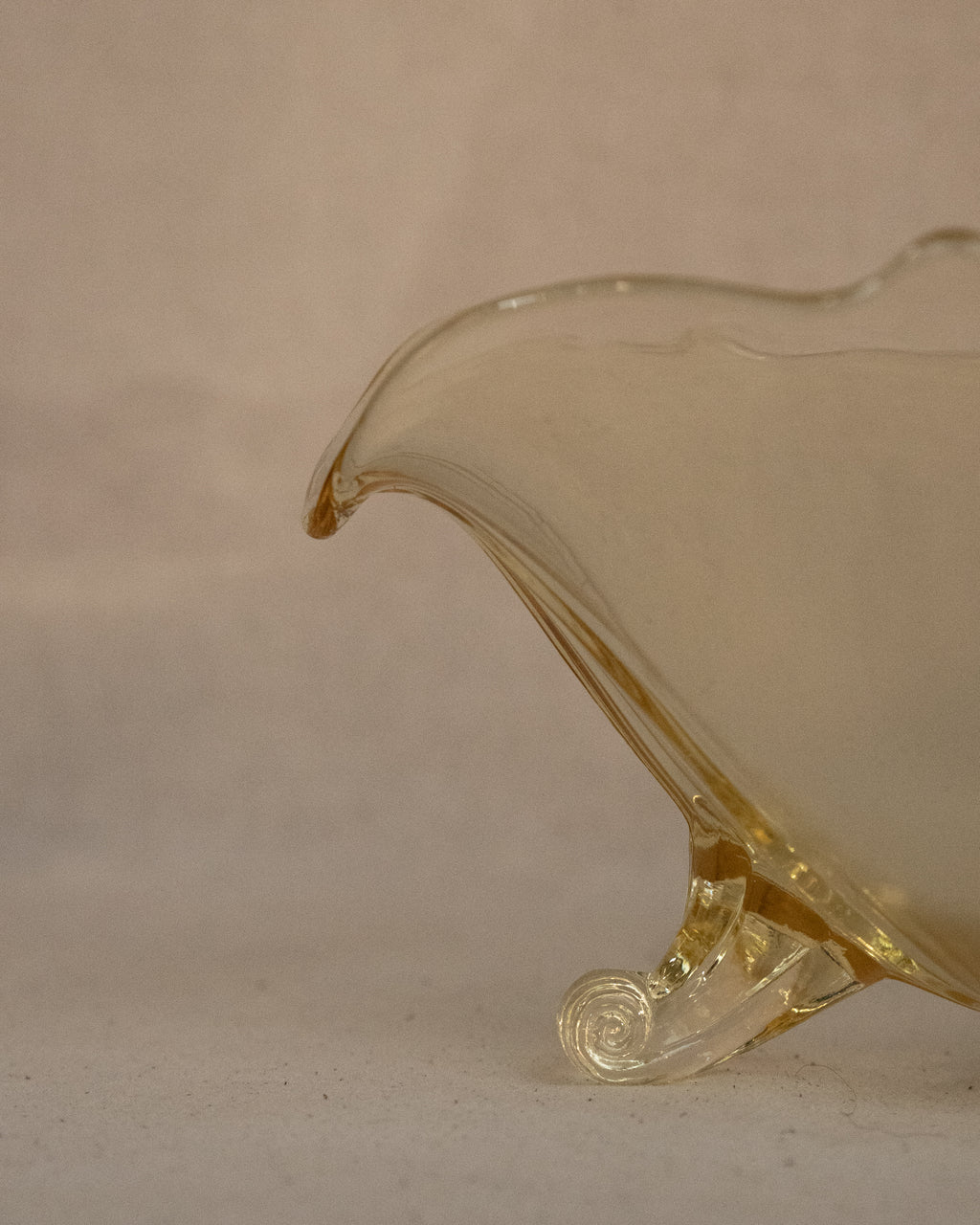 Yellow art glass bowl with spiral feet