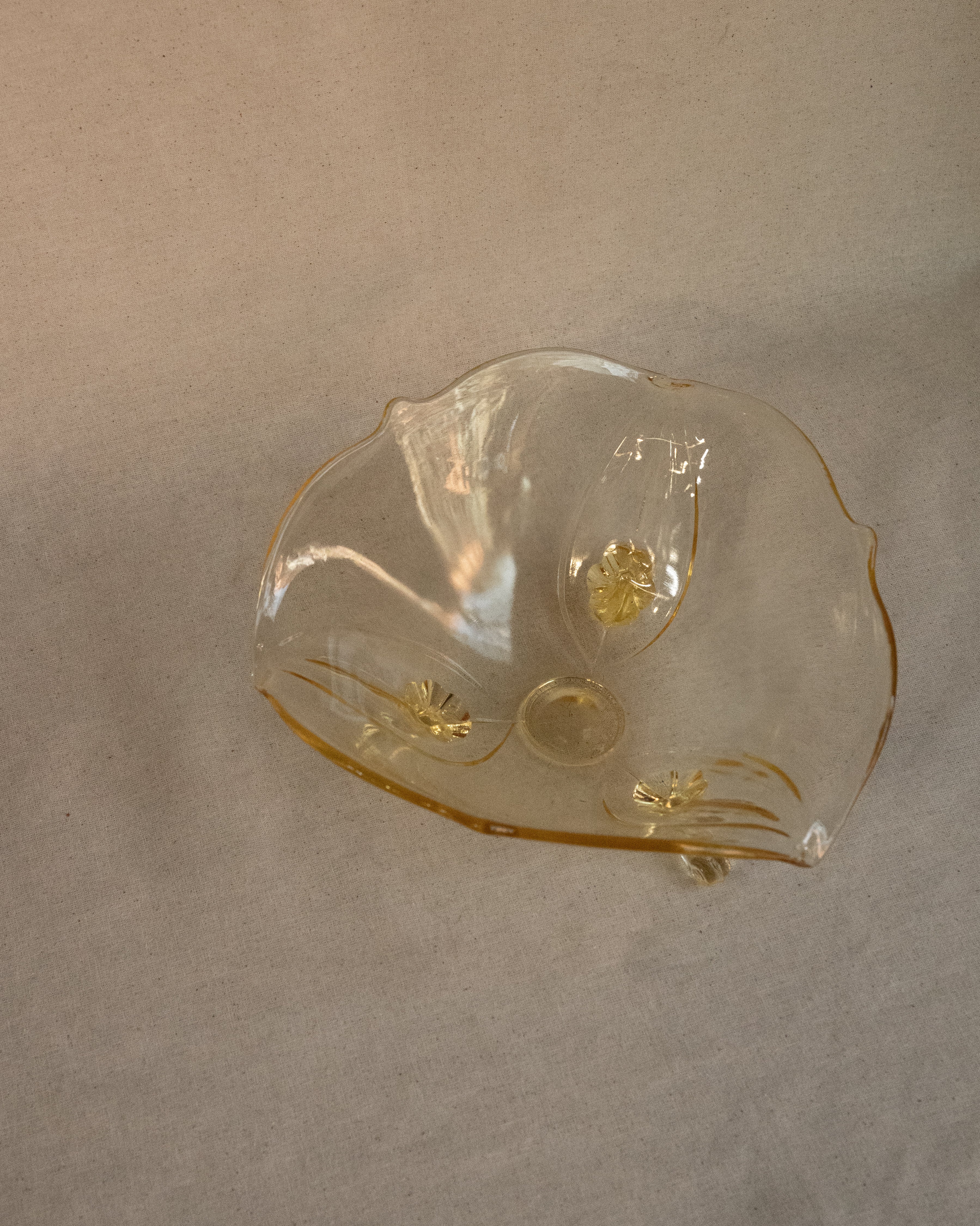 Yellow art glass bowl with spiral feet