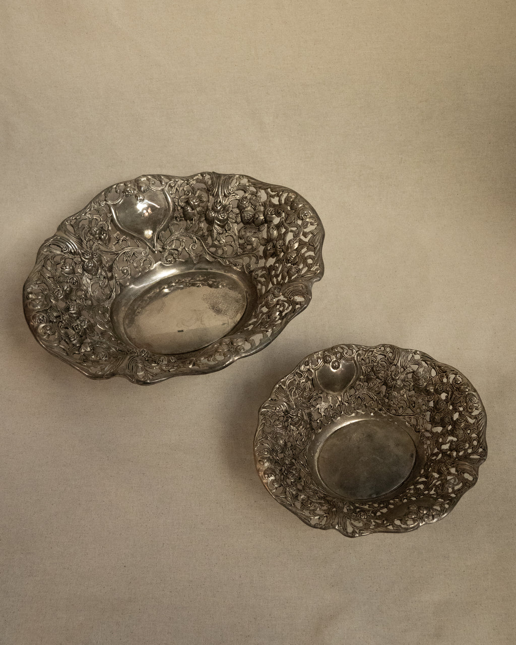 Pair of silver finish bowls with rose details