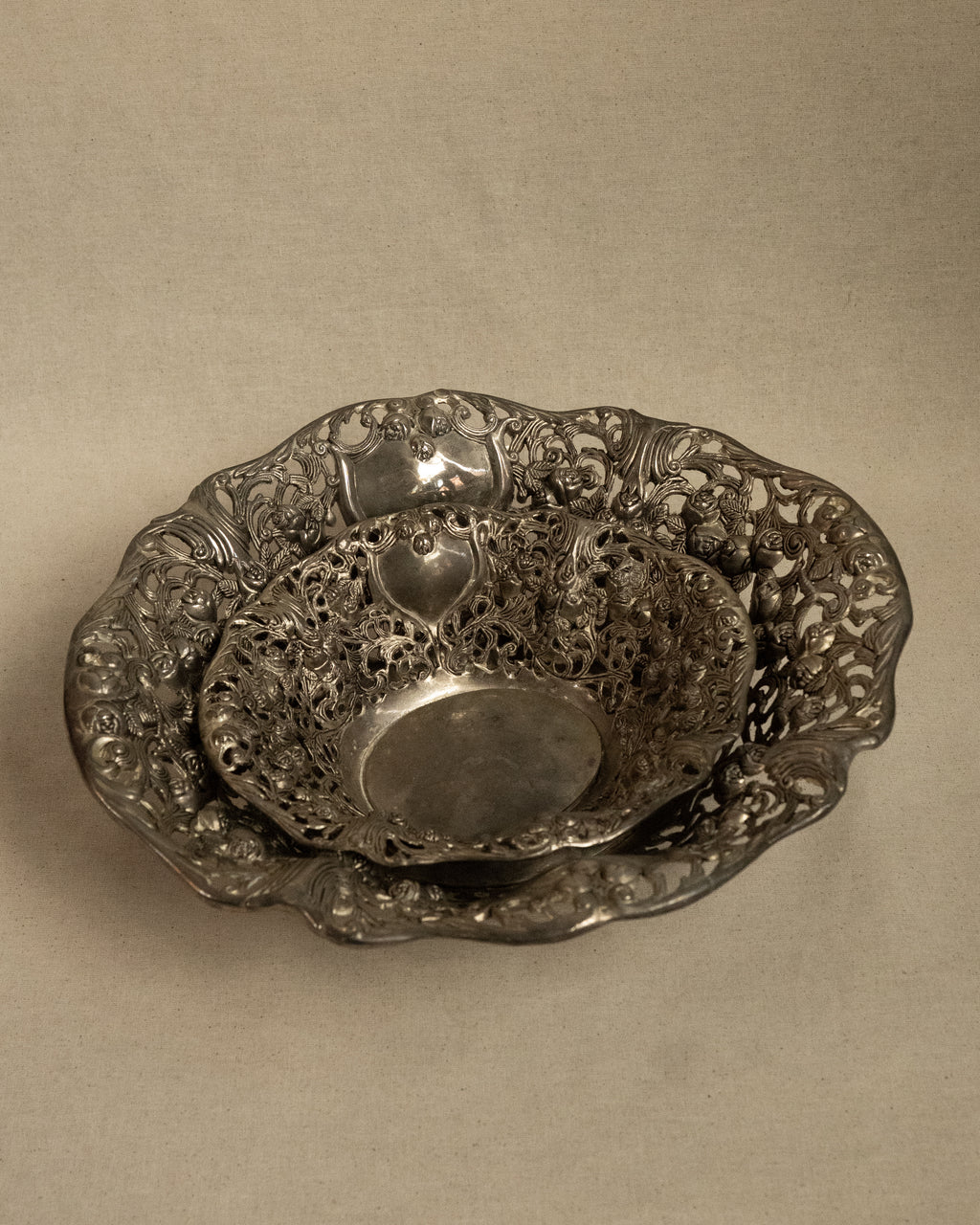Pair of silver finish bowls with rose details