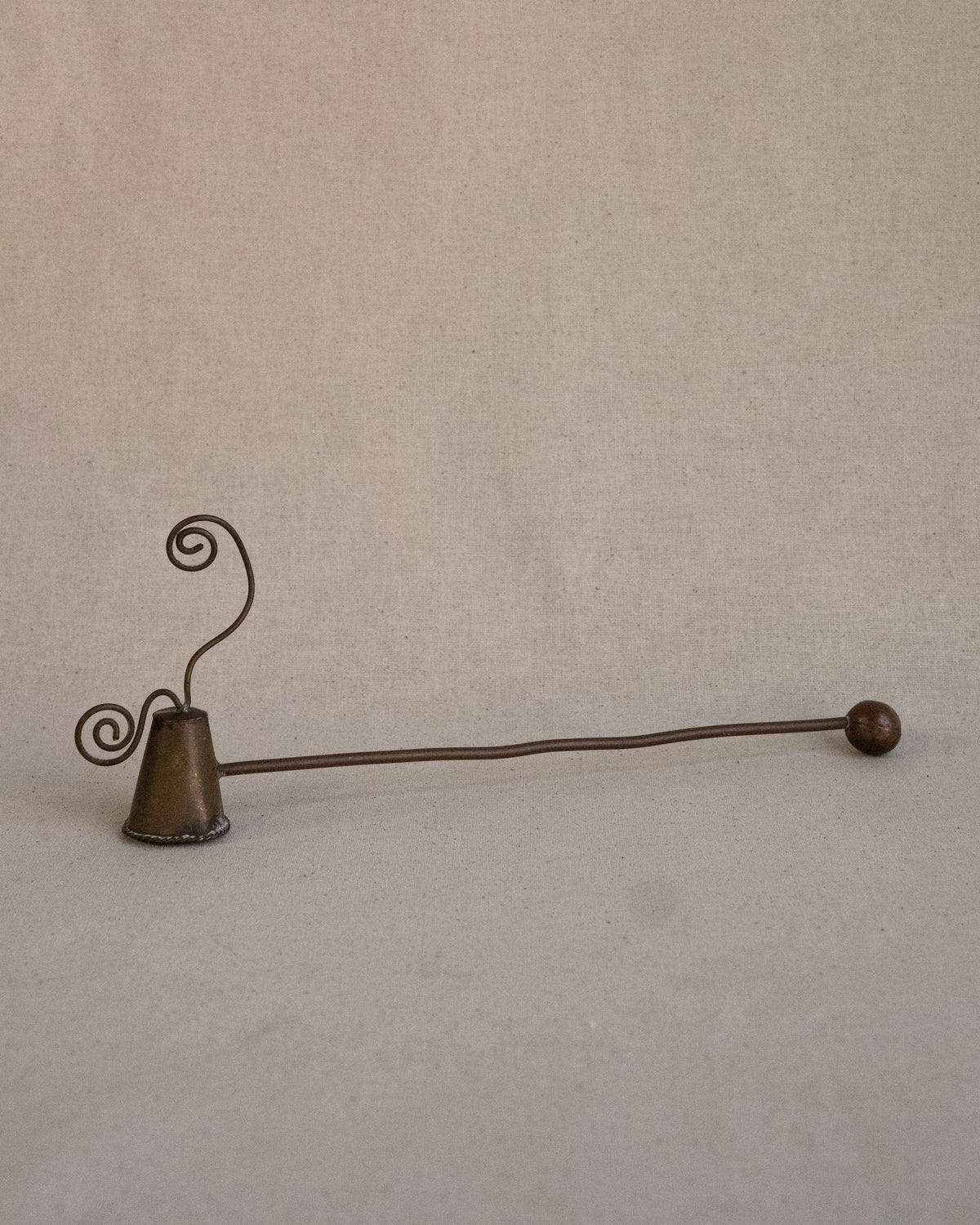 Metal candle snuffer with spirals