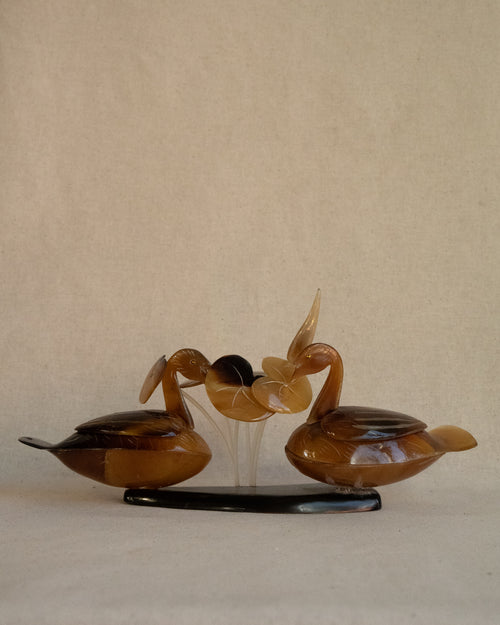 Swans amongst lily pads sculpture