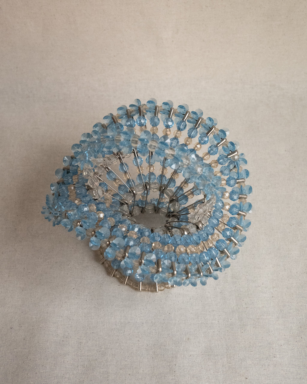 Beaded basket assembled using safety pins