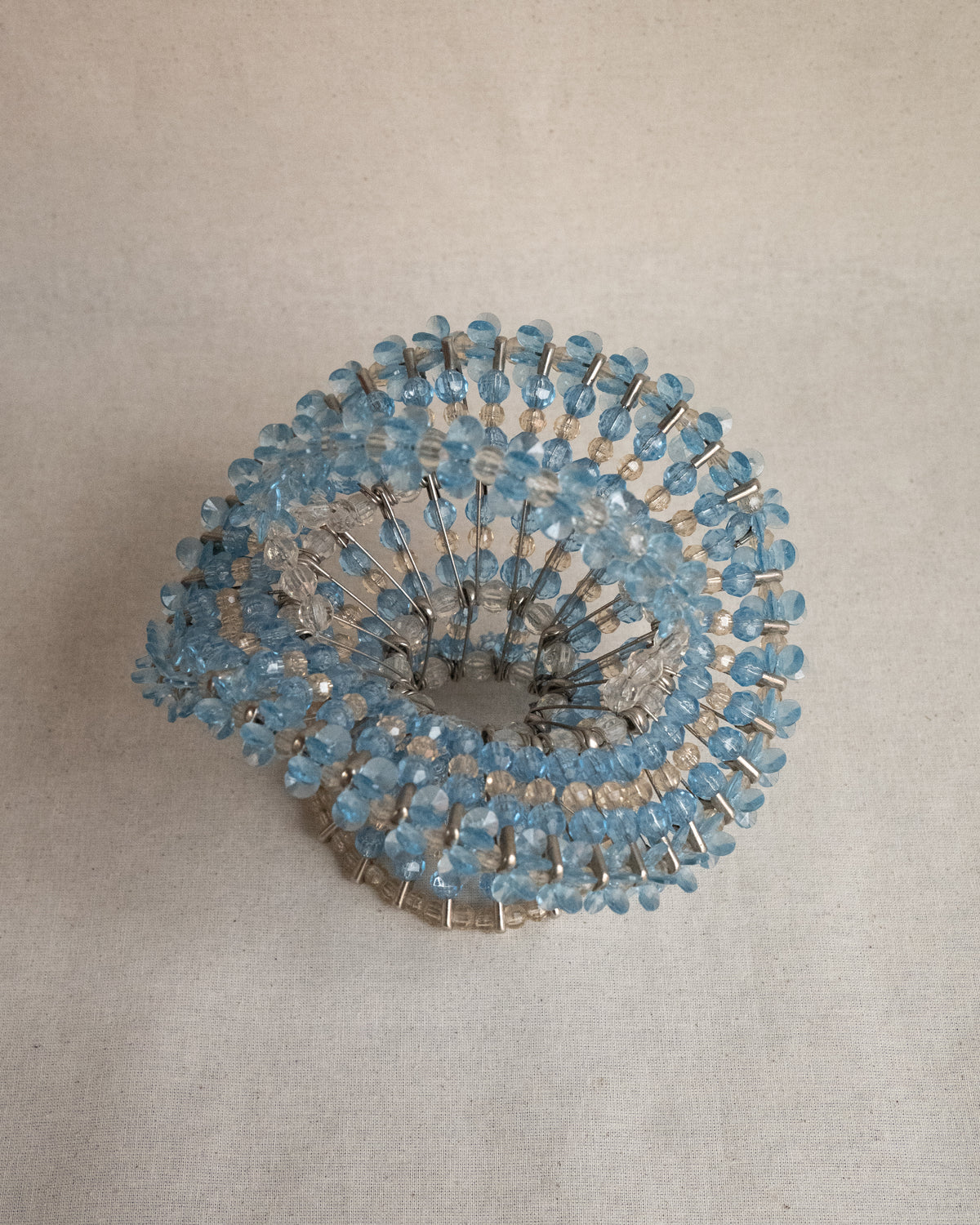 Beaded basket assembled using safety pins