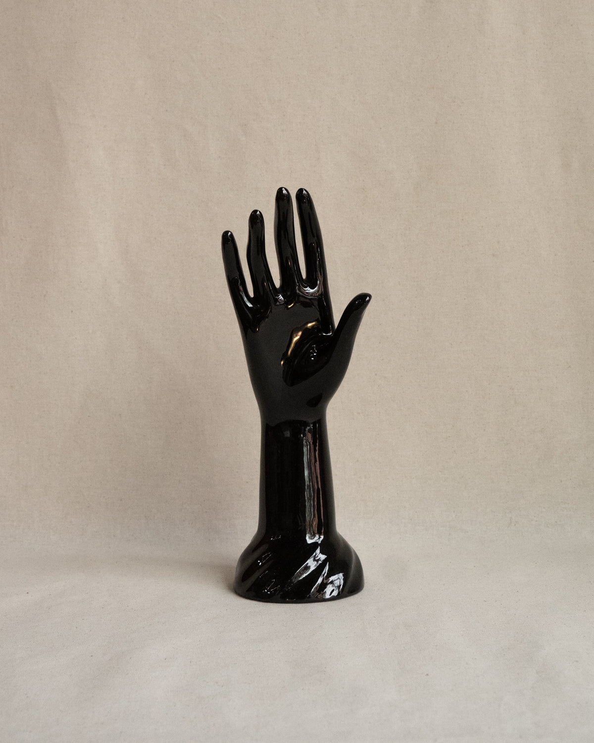 Black ceramic hand sculpture and jewellery stand