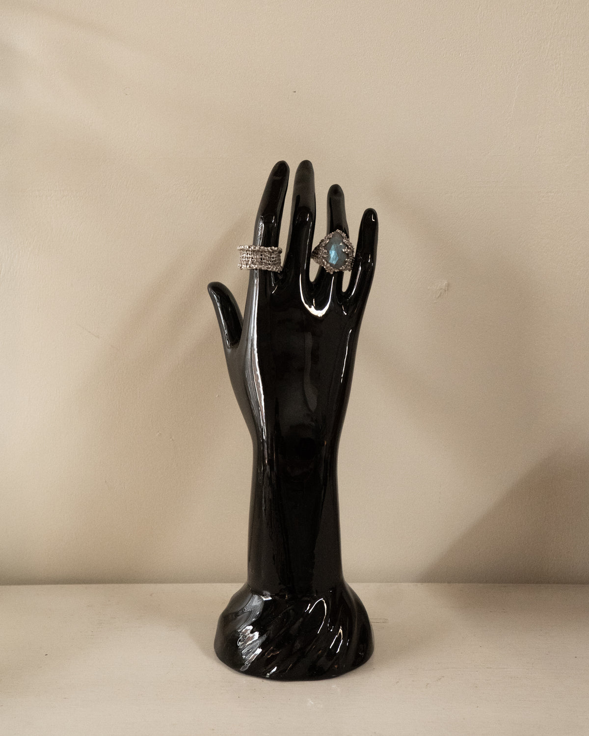 Black ceramic hand sculpture and jewellery stand