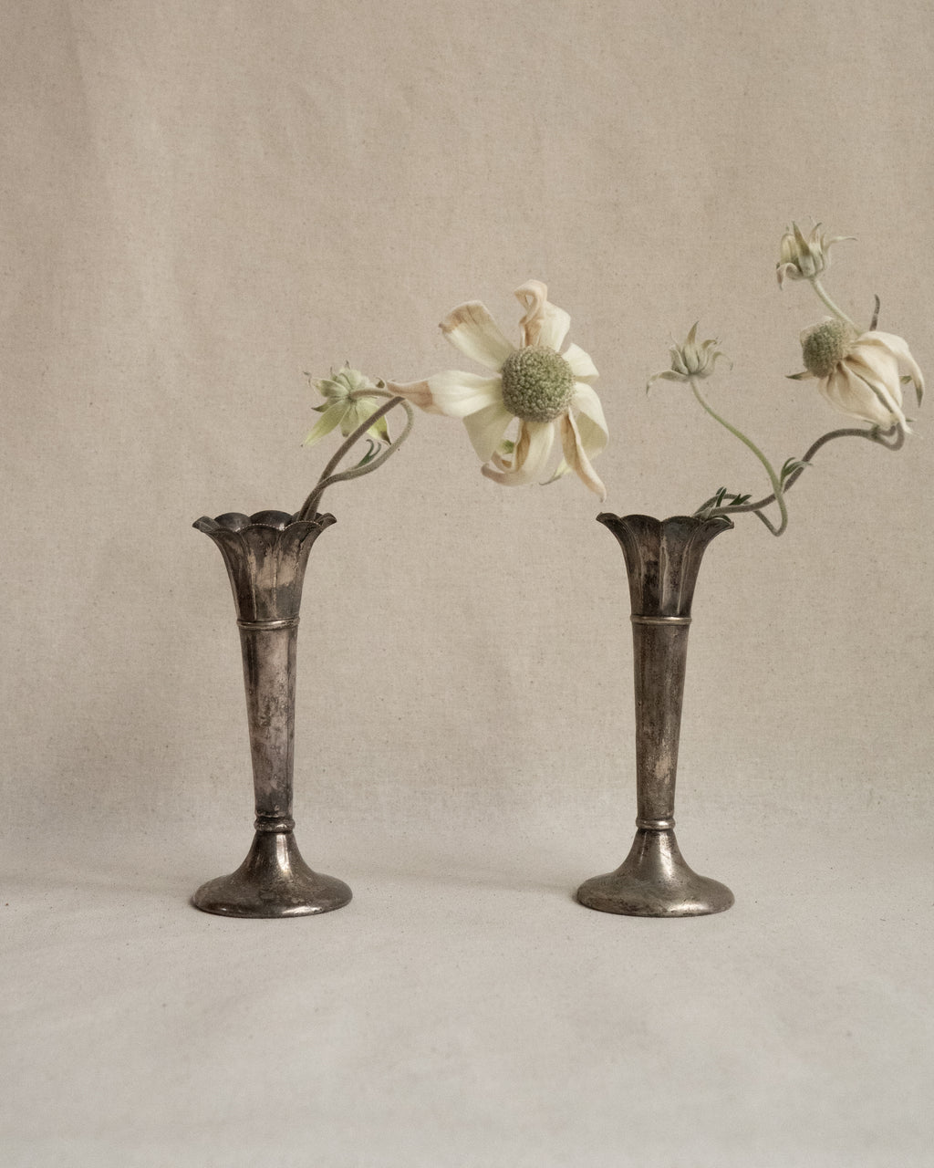 Pair of small silver plated tapered vases