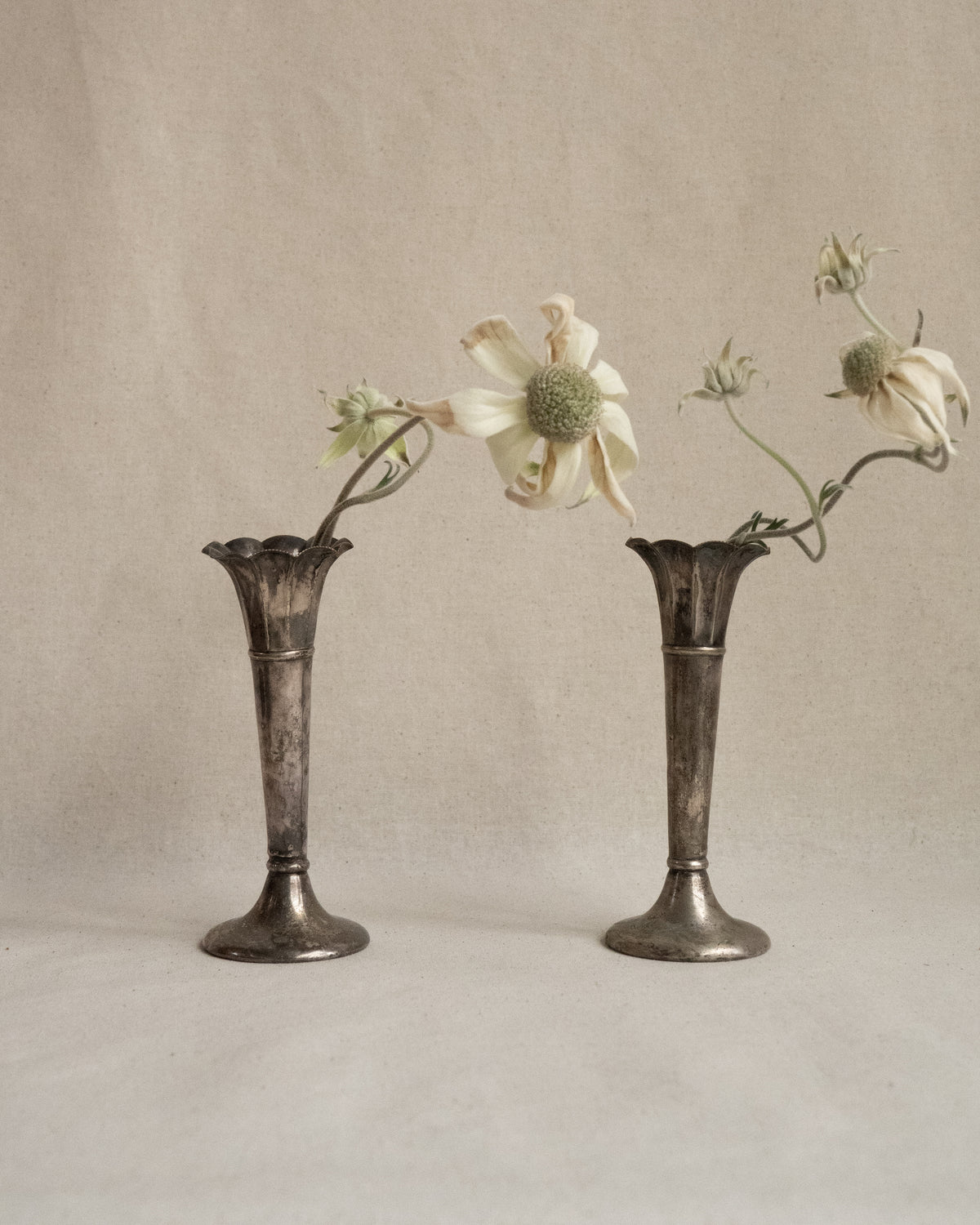 Pair of small silver plated tapered vases