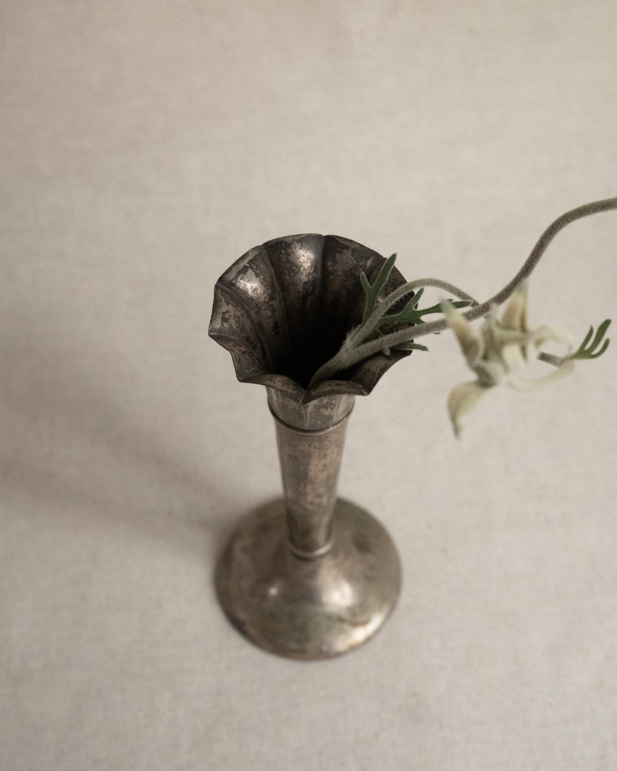 Pair of small silver plated tapered vases