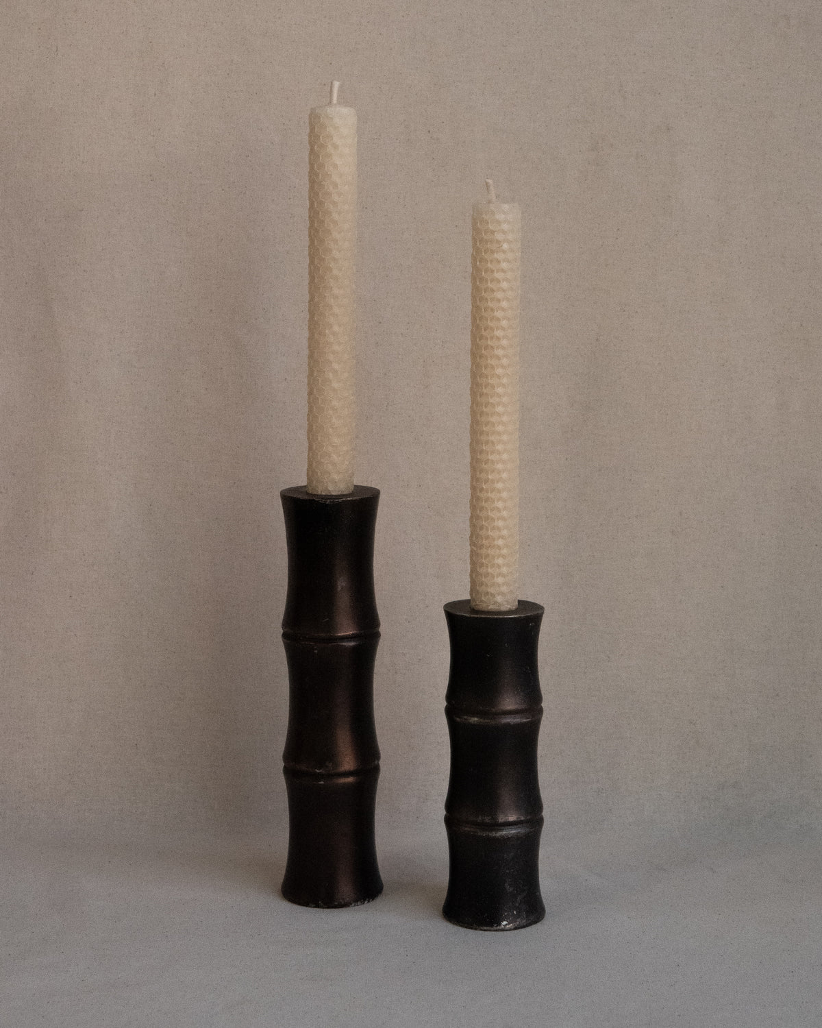 Pair of solid metal bamboo candle holders