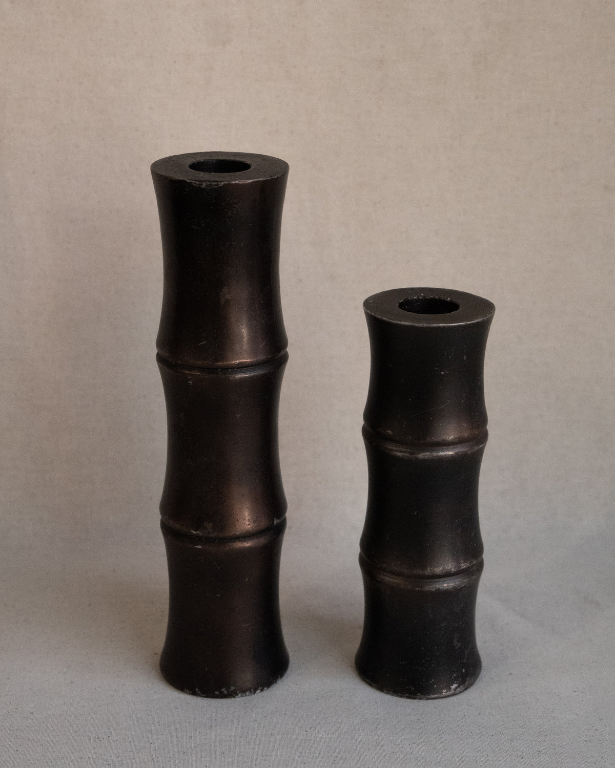 Pair of solid metal bamboo candle holders