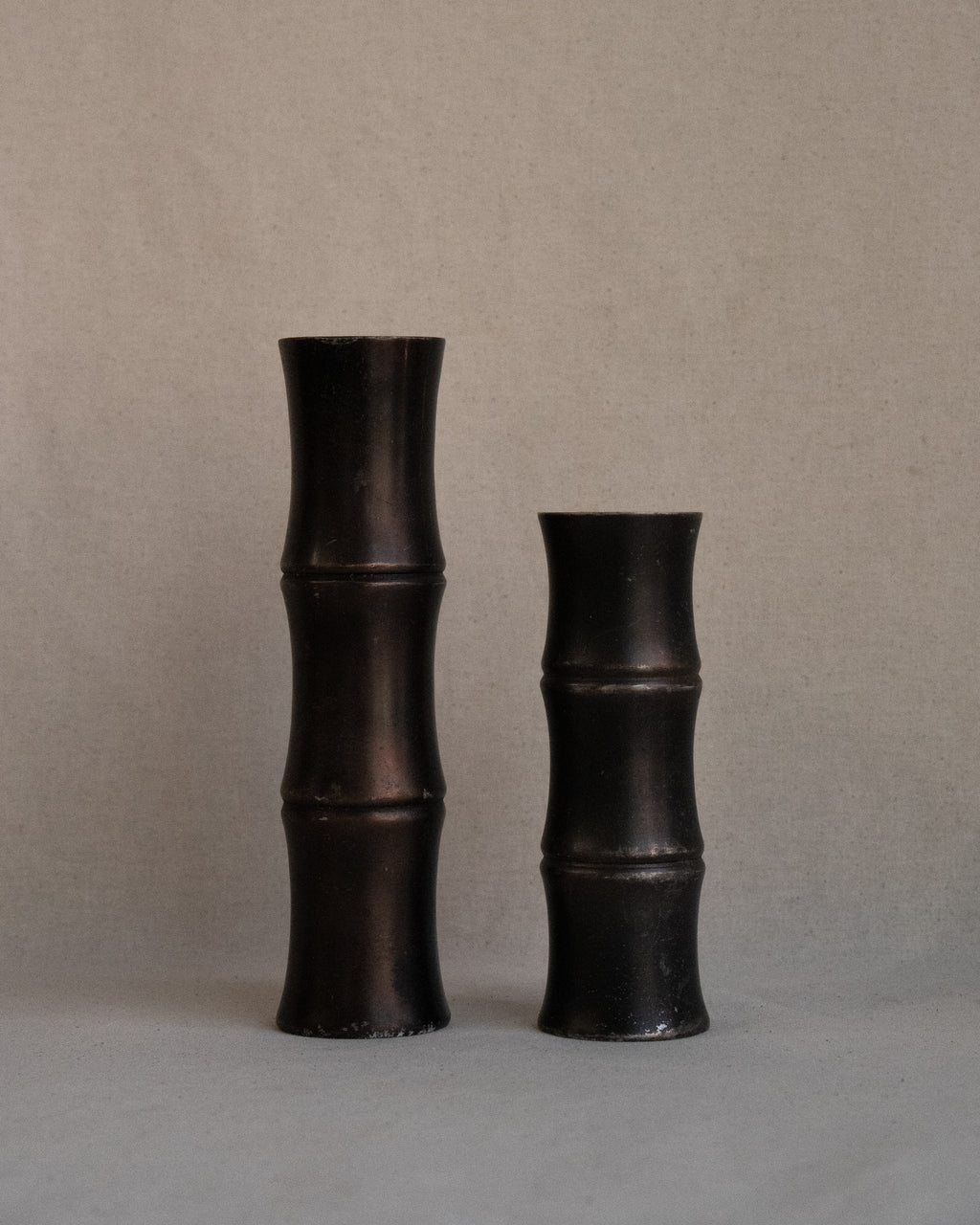 Pair of solid metal bamboo candle holders