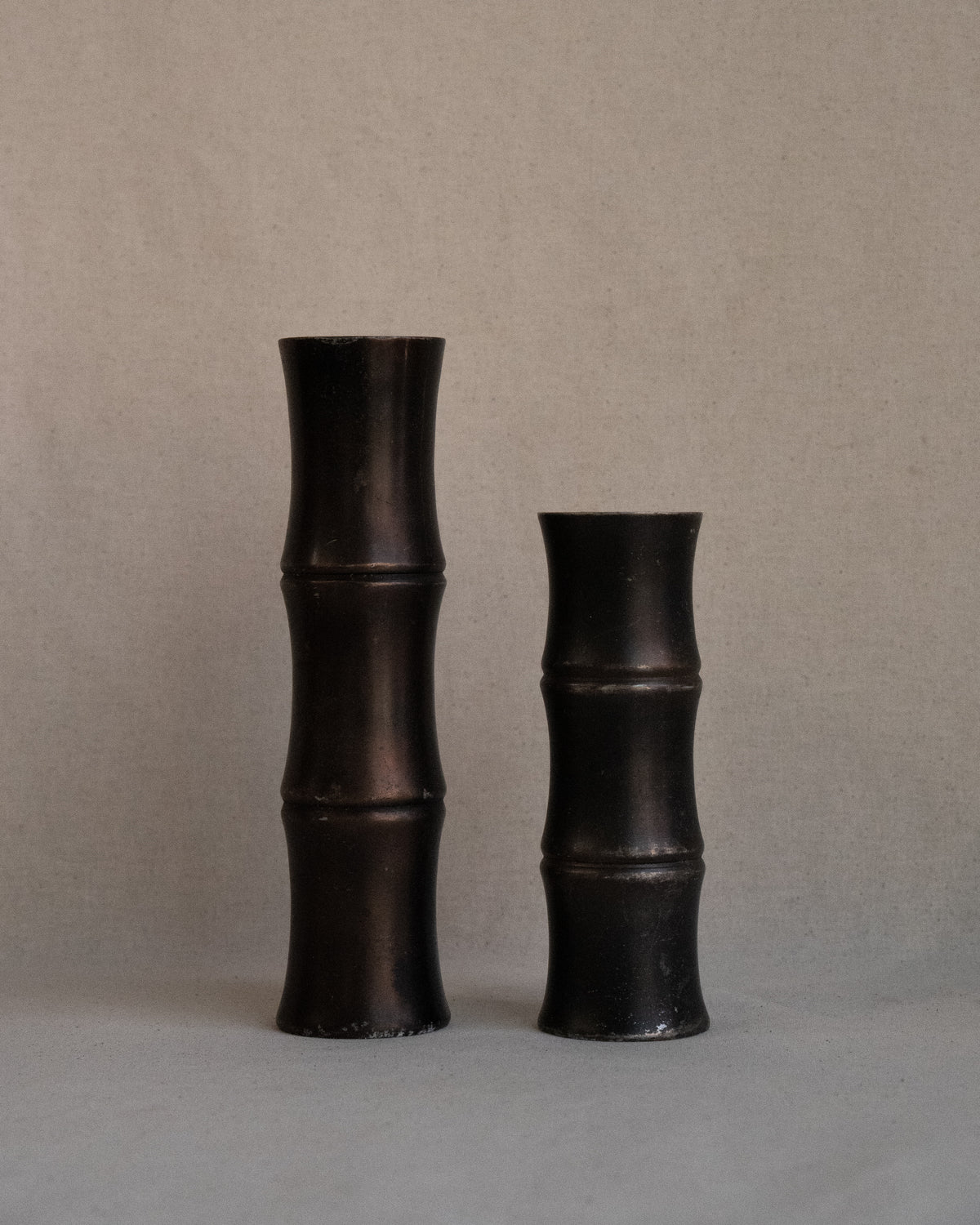 Pair of solid metal bamboo candle holders
