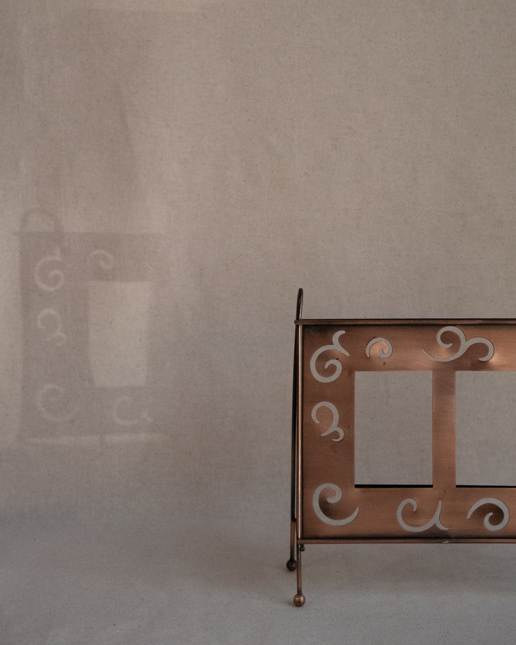 Copper finish dual picture frame with spiral cutouts