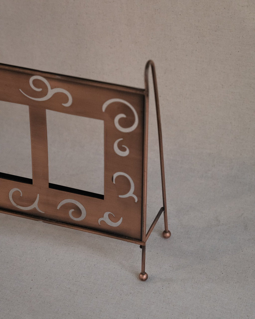 Copper finish dual picture frame with spiral cutouts