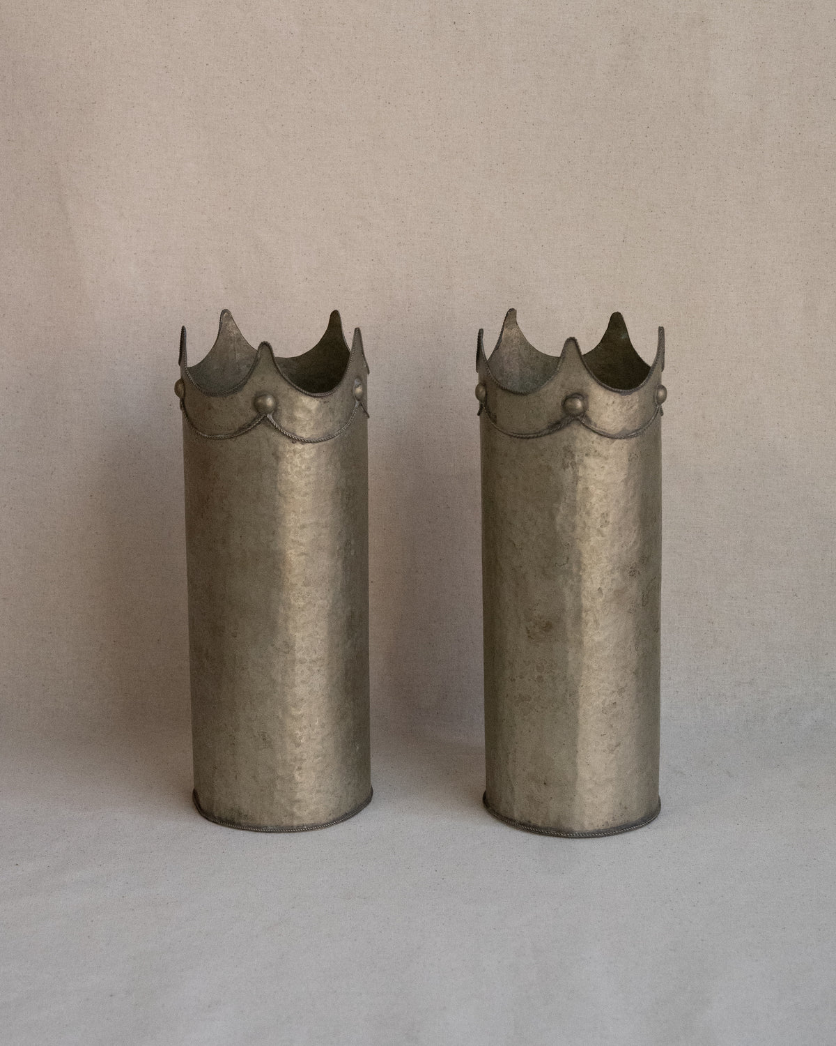 Hammered metal wine bottle holder/vase with crown detail
