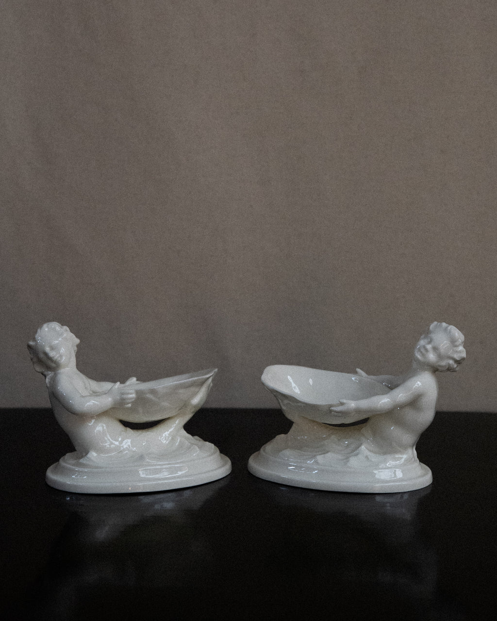 Pair of merman and mermaid on waves salt dishes, Made in England