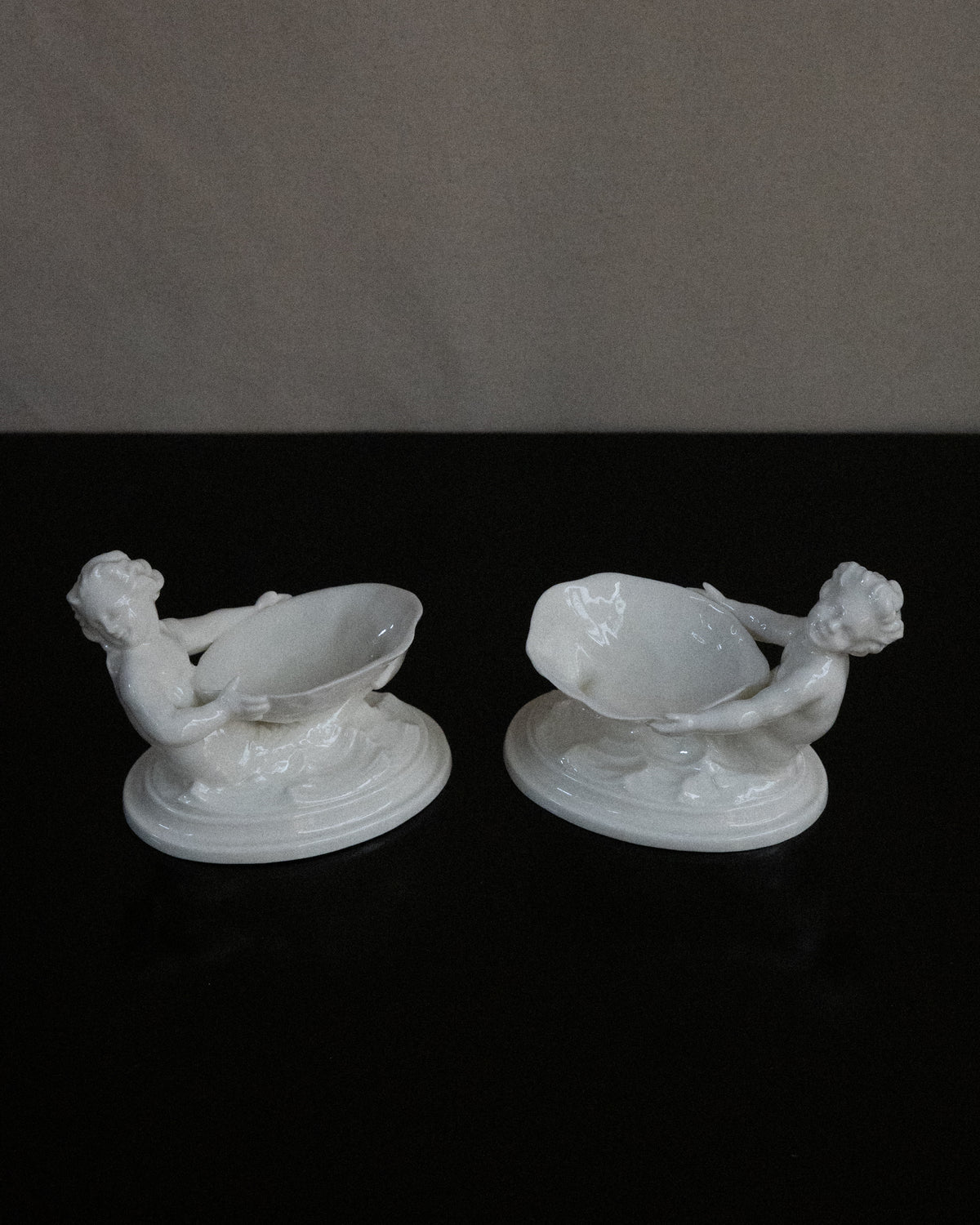 Pair of merman and mermaid on waves salt dishes, Made in England