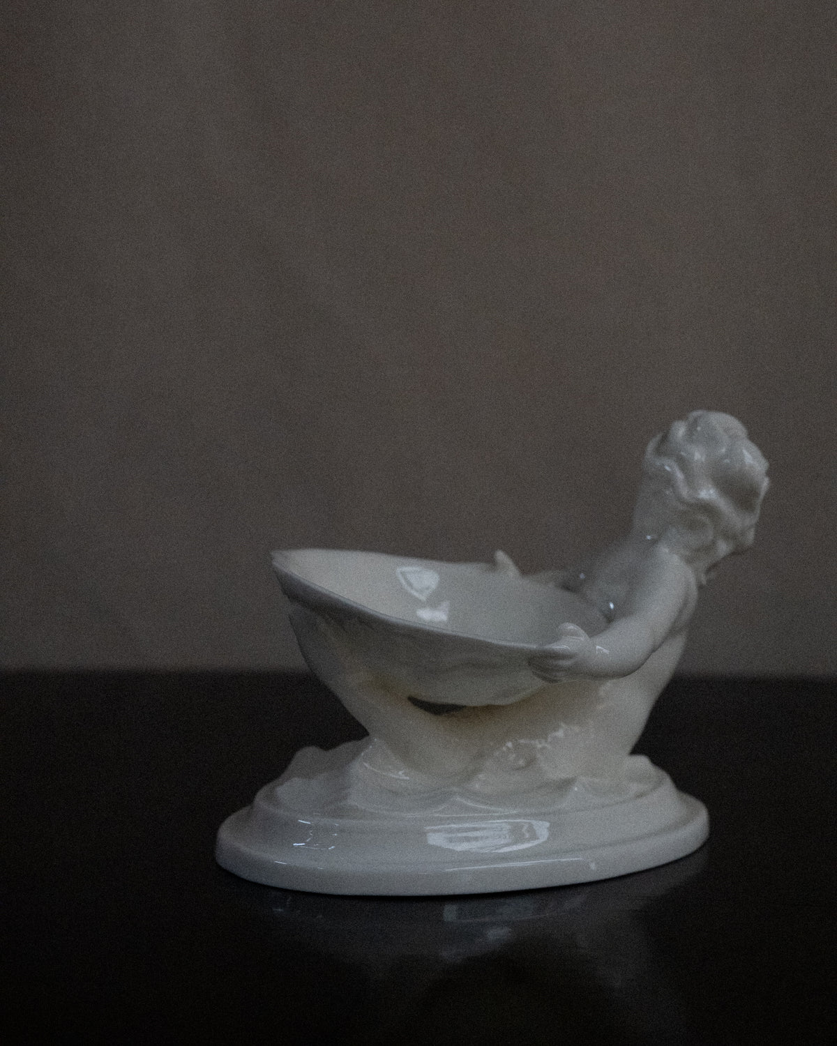Pair of merman and mermaid on waves salt dishes, Made in England