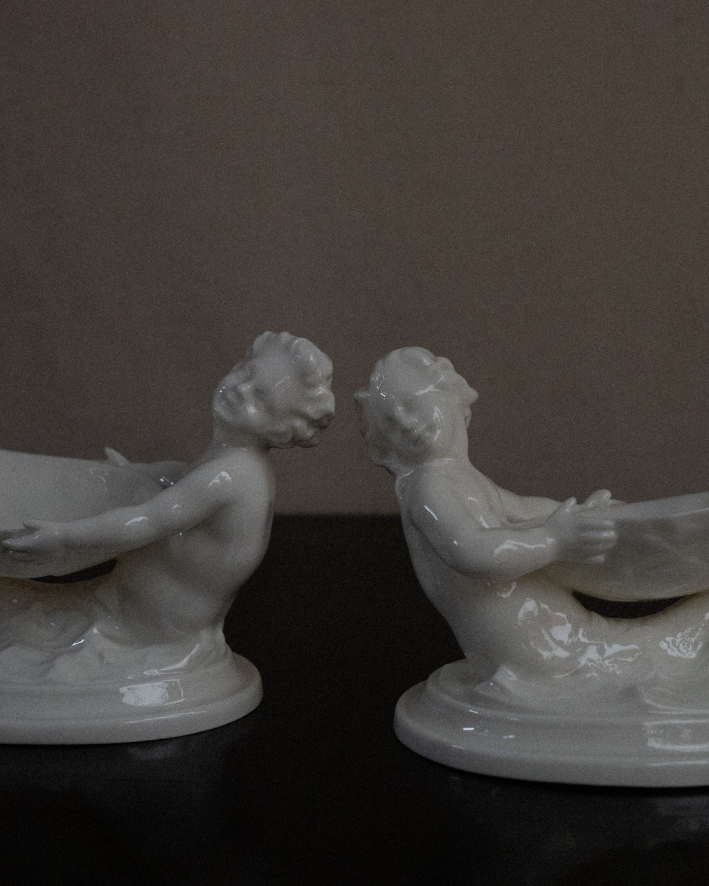 Pair of merman and mermaid on waves salt dishes, Made in England
