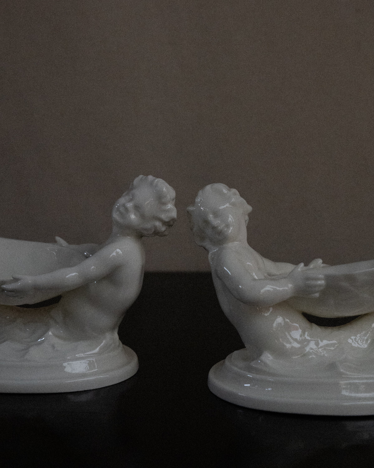 Pair of merman and mermaid on waves salt dishes, Made in England