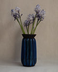 Cobalt blue glass bubble vessel in wrought iron cage vase