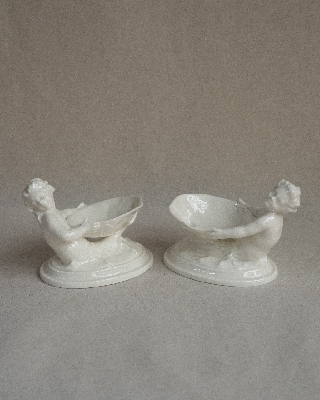 Pair of merman and mermaid on waves salt dishes, Made in England