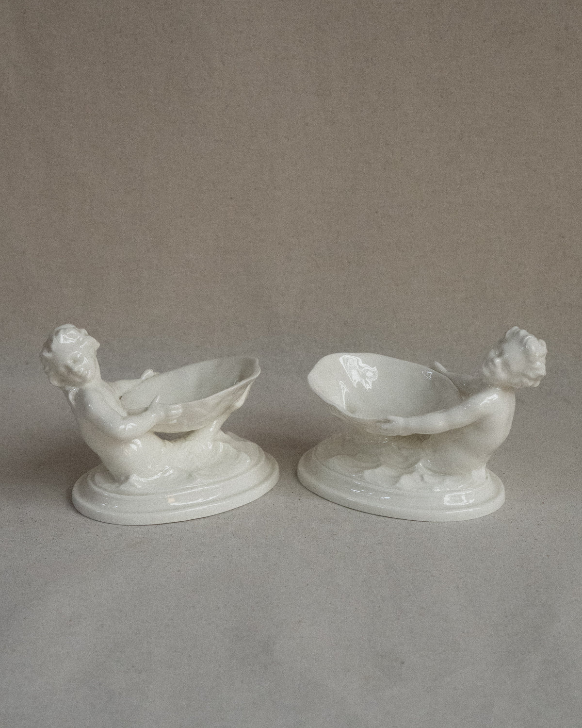 Pair of merman and mermaid on waves salt dishes, Made in England