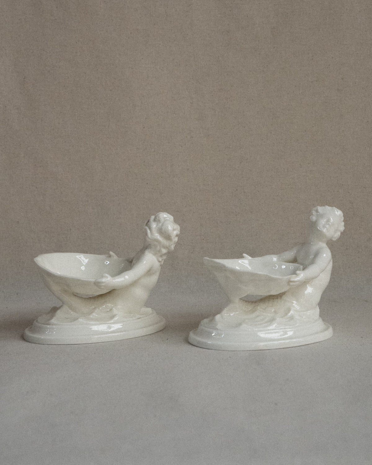 Pair of merman and mermaid on waves salt dishes, Made in England