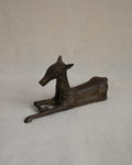 Brass deer sitting sculpture