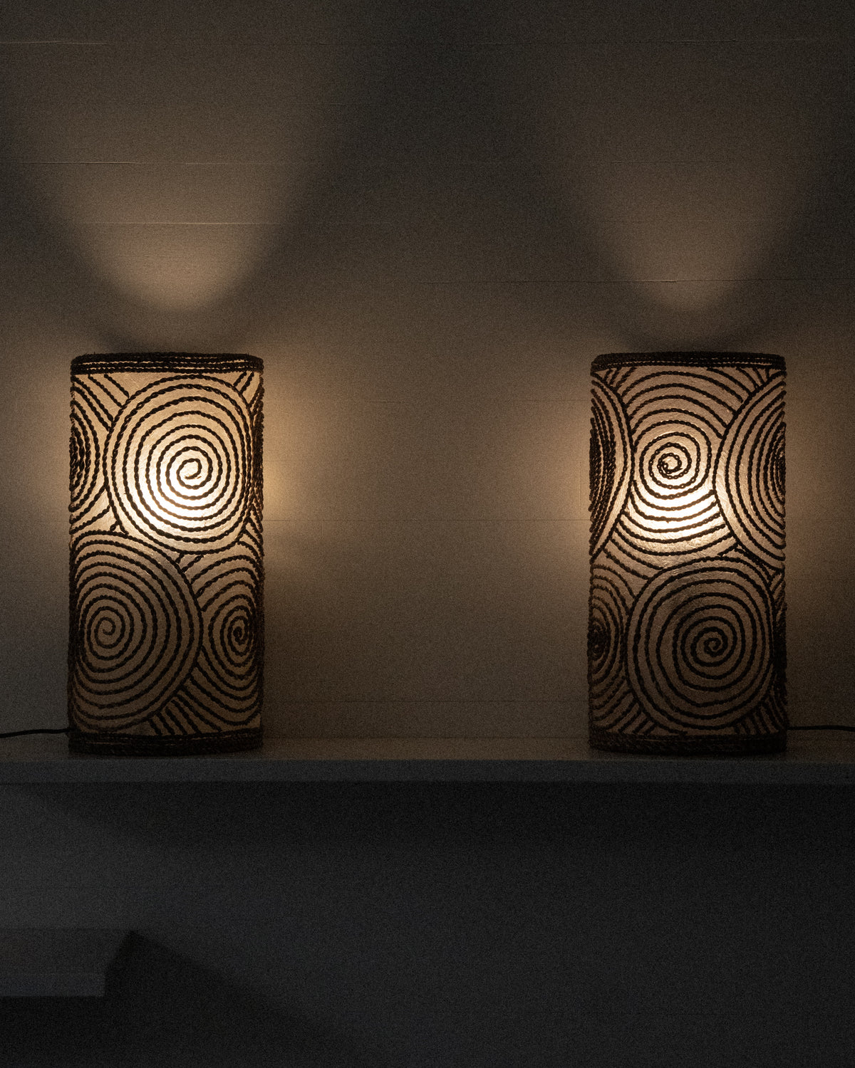 Cylindrical fiberglass and woven spiral table lamp
