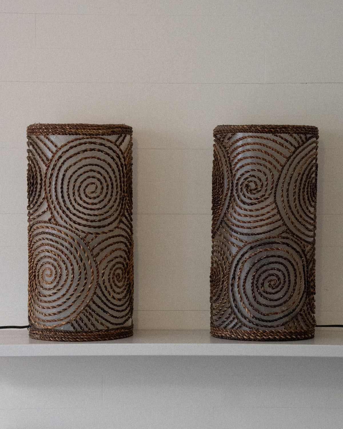 Cylindrical fiberglass and woven spiral table lamp