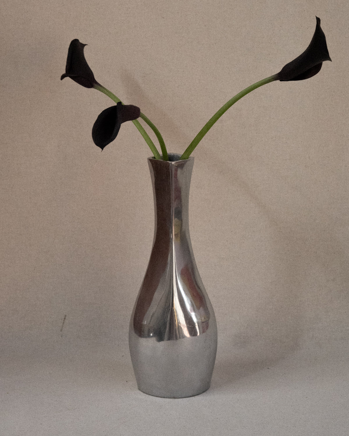 Aluminum vase with tapered neck