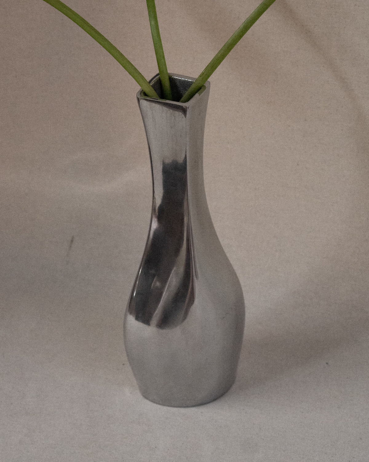 Aluminum vase with tapered neck