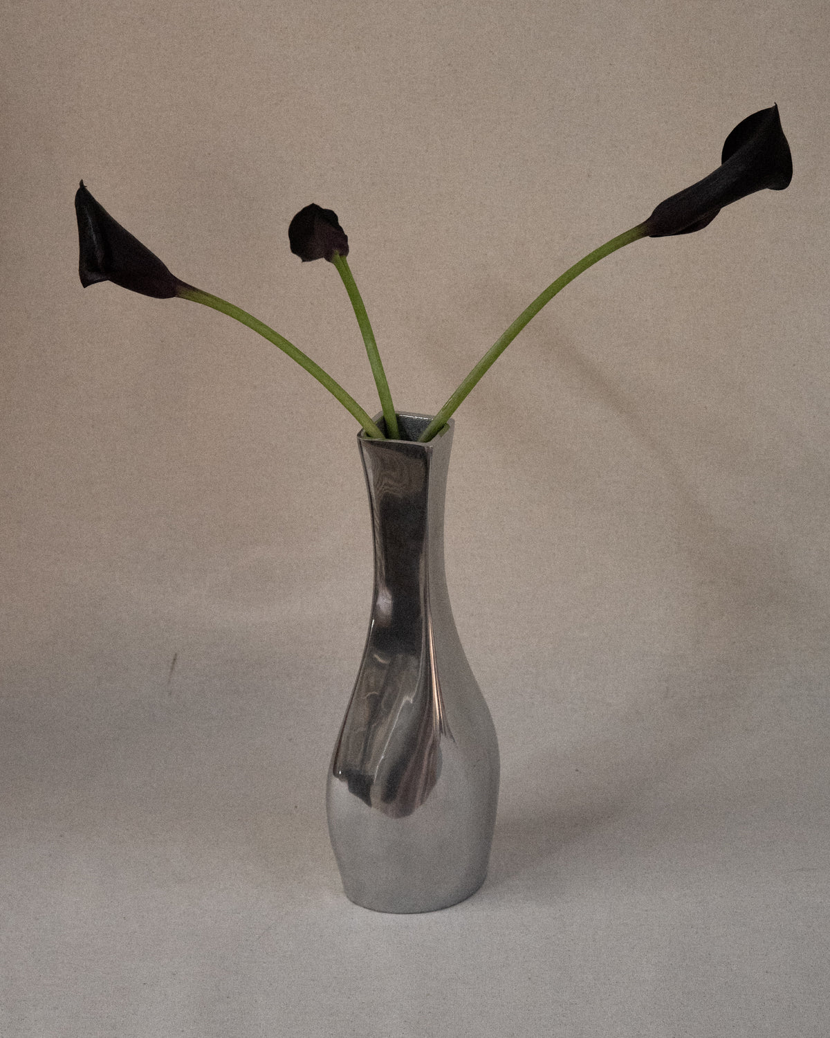 Aluminum vase with tapered neck
