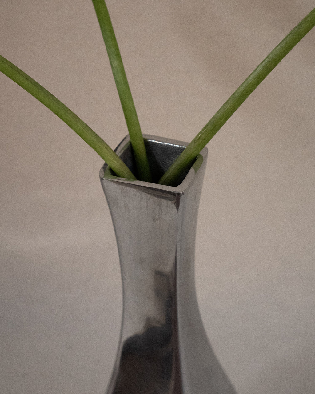 Aluminum vase with tapered neck