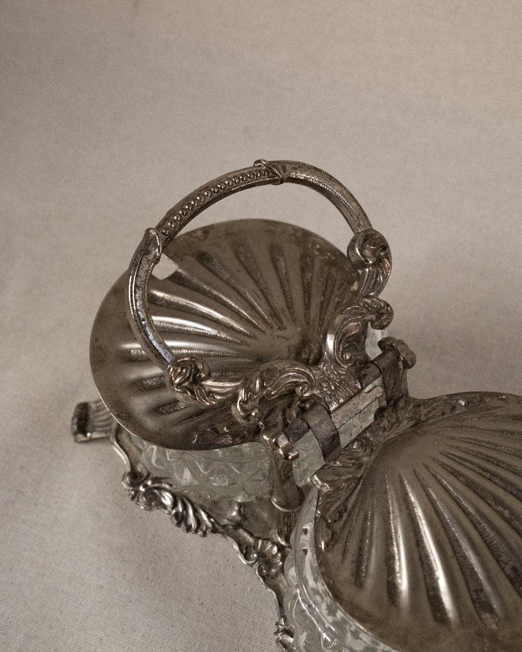 Silver plated shell condiment tray with handle and two glass bowl inserts