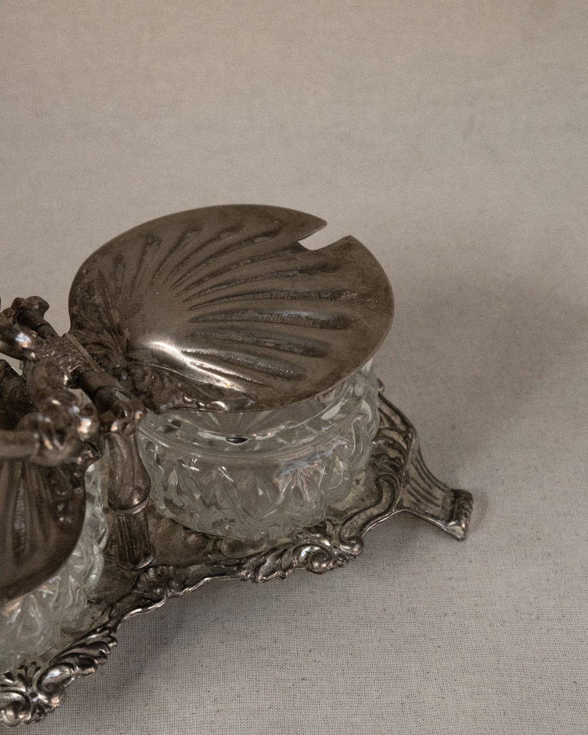 Silver plated shell condiment tray with handle and two glass bowl inserts