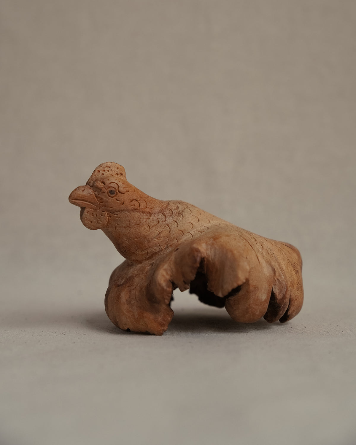 Folk art carved burl wood hen