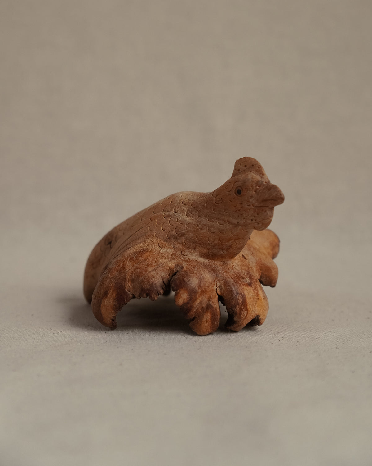 Folk art carved burl wood hen