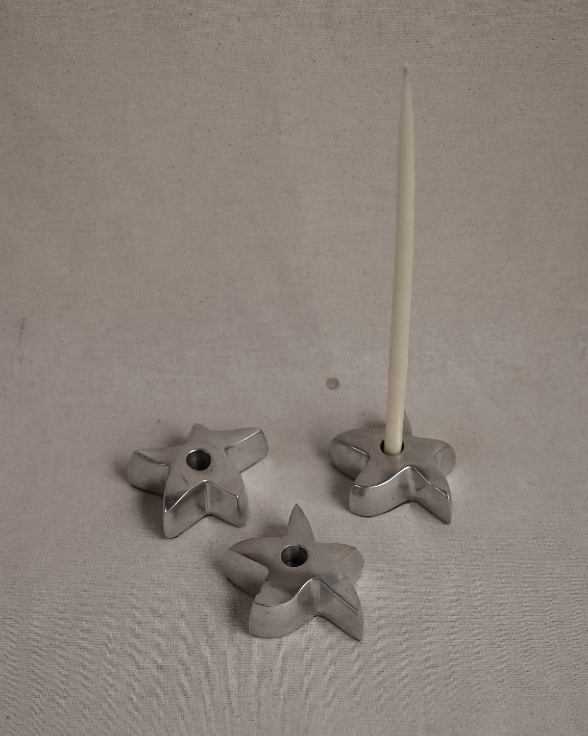 Star aluminum candle holder