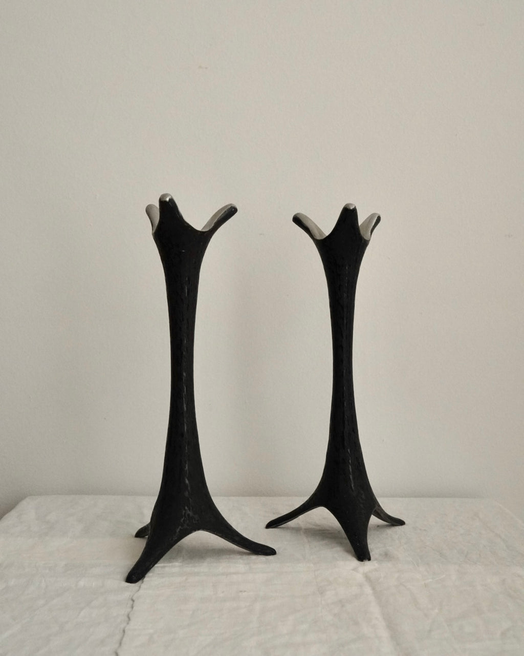 Pair of metal candle holders in black
