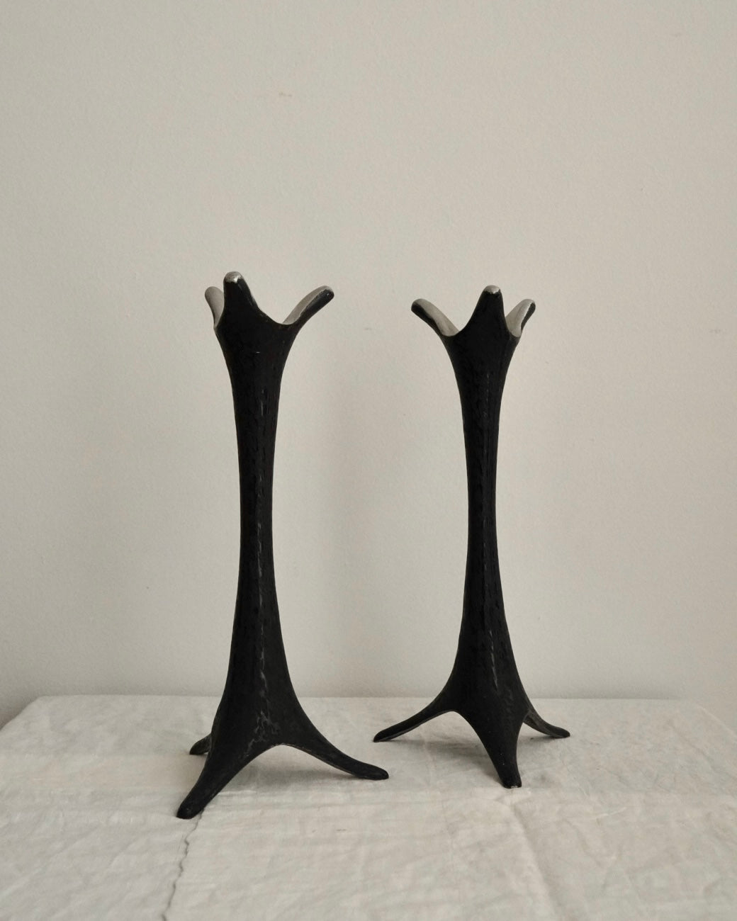 Pair of metal candle holders in black