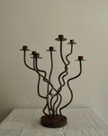 Steel squiggly candelabra