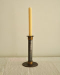 Metal candle holder with brass wrapped around