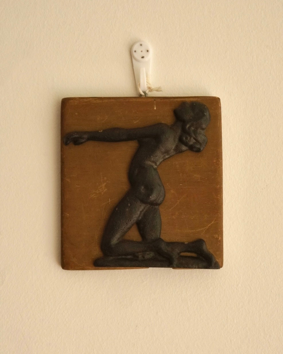 Metal female body with wooden backing wall hanging
