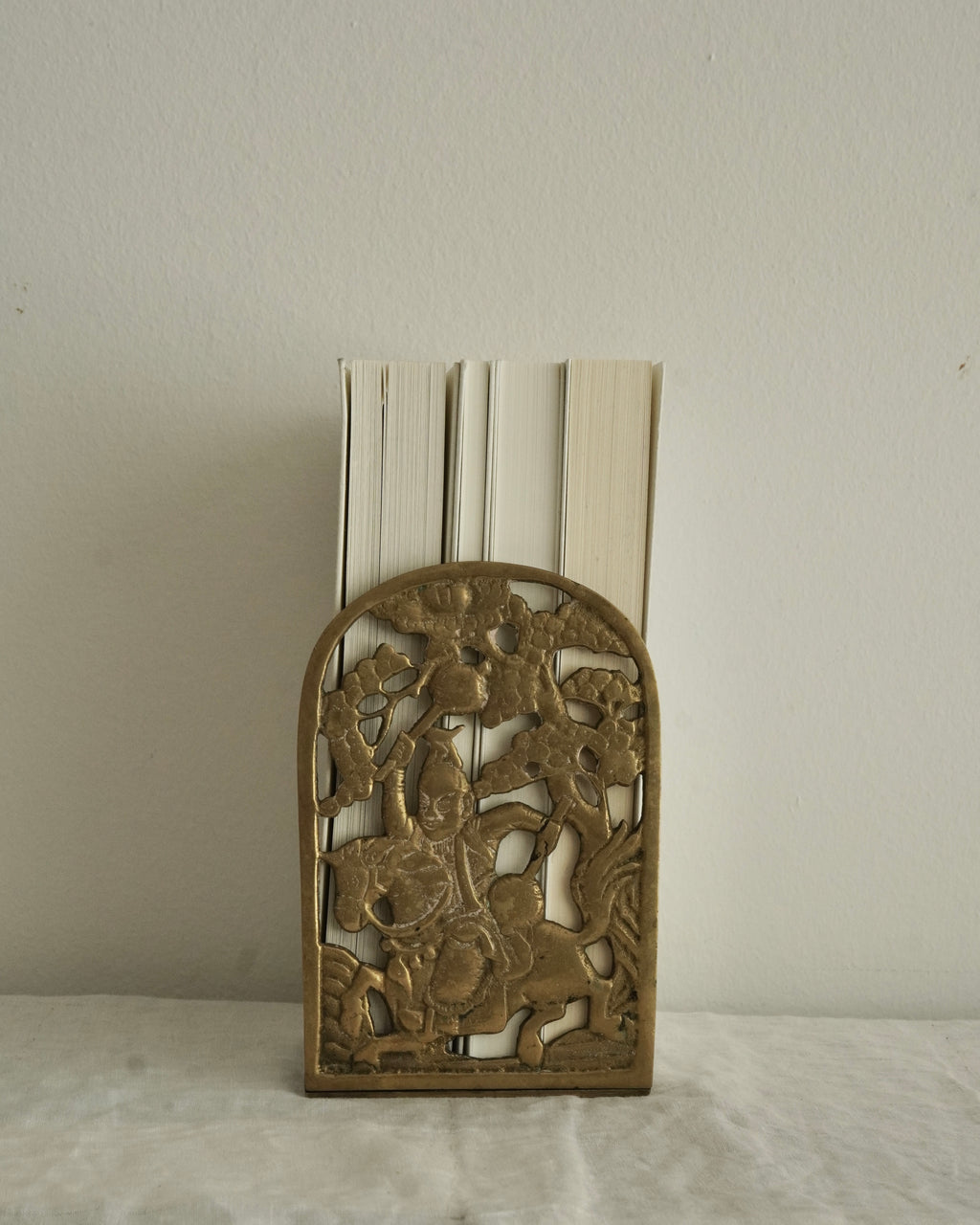 Brass chinese man on a horse bookend